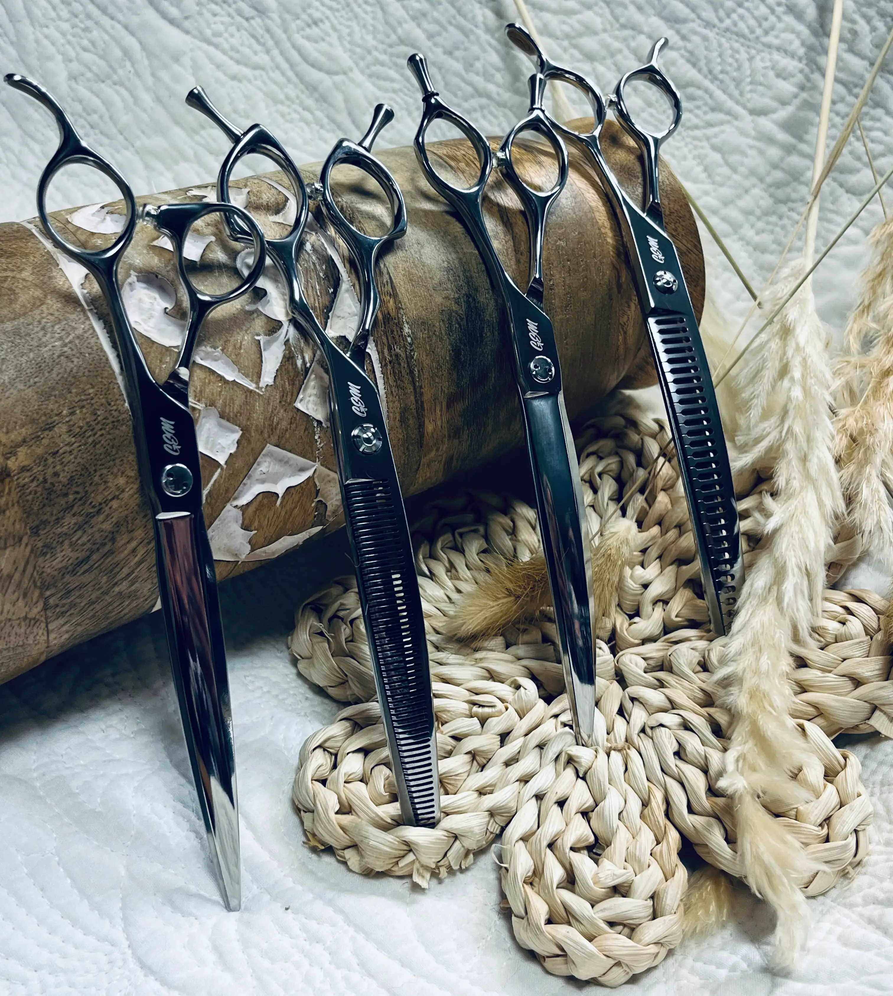 Set of four professional hairdressing scissors