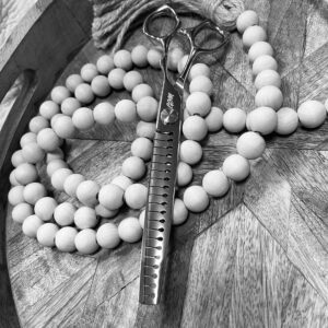 Thinning scissors on decorative wooden bead garland