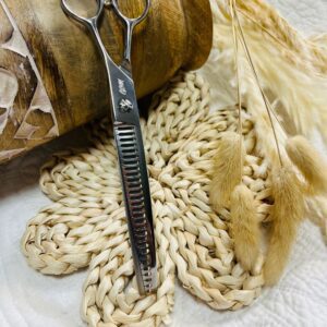 Thinning scissors on woven mat with dried grasses