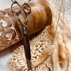Thinning shears on woven mat with dried grasses