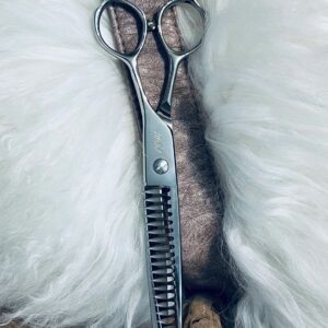 Silver hair thinning scissors on white fur